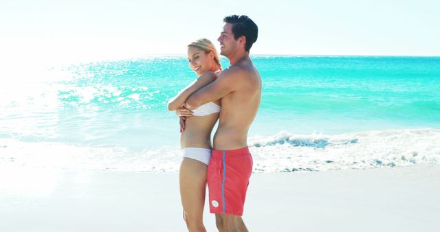 Couple romancing at beach on a sunny day 4k - Download Free Stock Photos Pikwizard.com