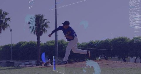 Dynamic baseball pitcher in action under blue sky