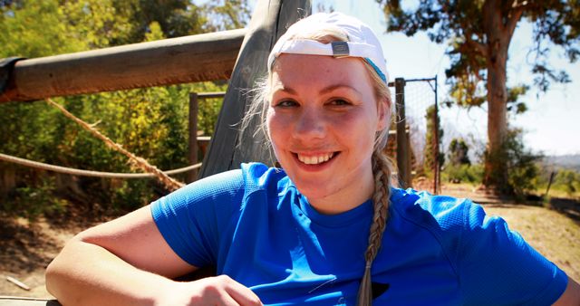 Smiling Woman in Athletic Gear Relaxing Outdoors - Download Free Stock Images Pikwizard.com