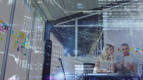 Colleagues Analyzing Digital Data Interface in Modern Office