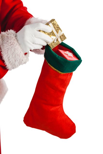 Santa Claus is seen placing gifts into a red Christmas stocking. This festive image is perfect for holiday-themed promotions, greeting cards, advertisements, and social media posts celebrating the Christmas season.
