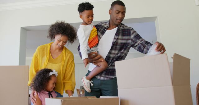 Black Family Unpacking Boxes in New Home Living Room - Download Free Stock Images Pikwizard.com