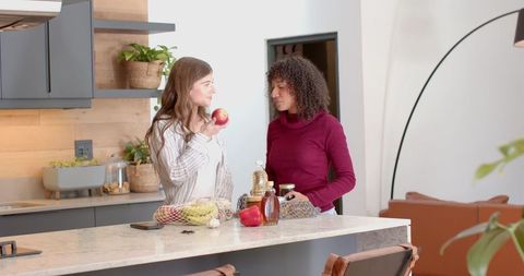 Diverse Friends Preparing Food in Modern Kitchen