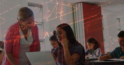 Teacher guiding students in tech-integrated math classroom