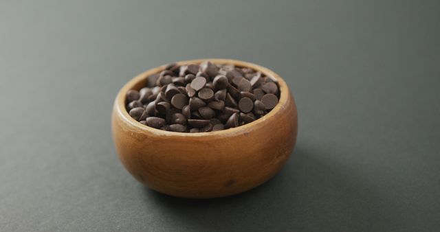 Wooden Bowl Filled with Chocolate Chips on Grey Background - Download Free Stock Images Pikwizard.com