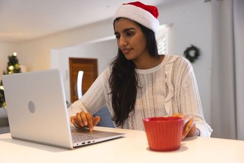 Festive Home Office Christmas Celebration with Santa Hat