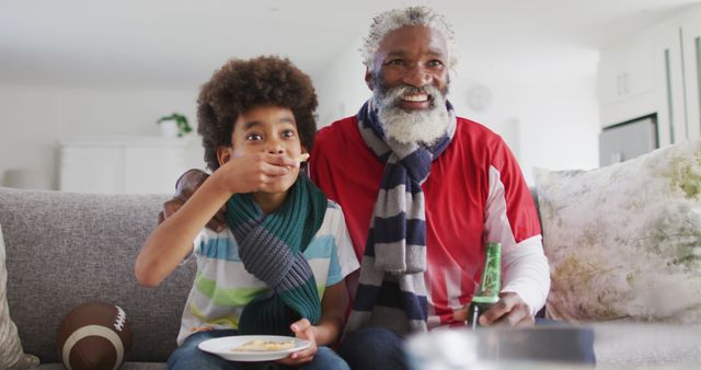 Grandfather and Grandson Enjoying Football Game at Home - Download Free Stock Images Pikwizard.com