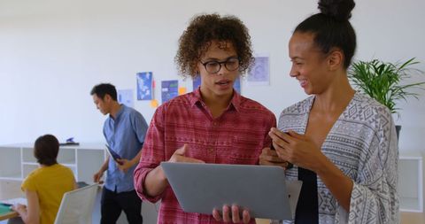 Diverse Office Team Collaborating with Technology Devices