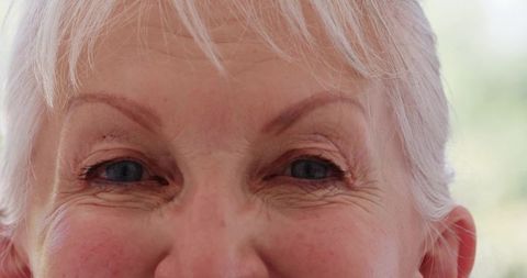 Close-up of senior woman gazing calmly with serenity and wisdom