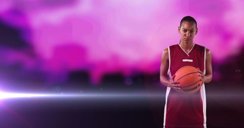 Female Basketball Player on Vibrant Background with Light Beam - Download Free Stock Images Pikwizard.com