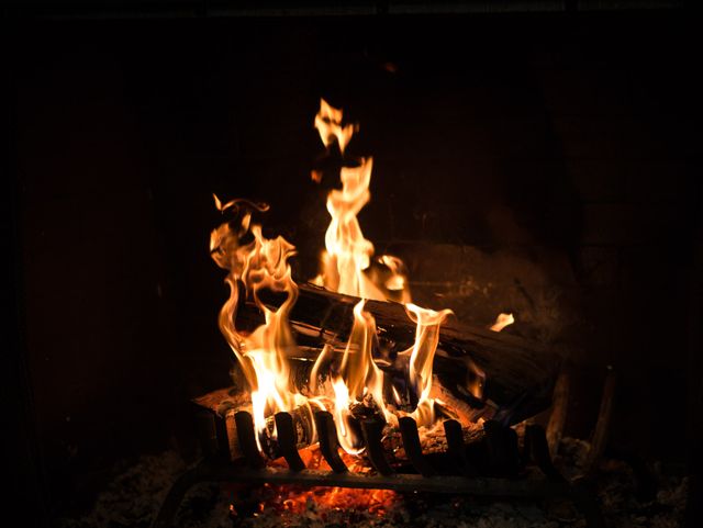 Burning Fireplace with Warm Flames and Outdoor Logs - Download Free Stock Photos Pikwizard.com