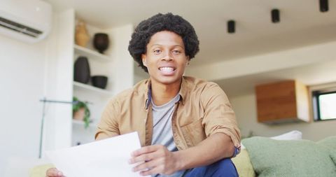 African American Man Video Calling at Home in Casual Atmosphere