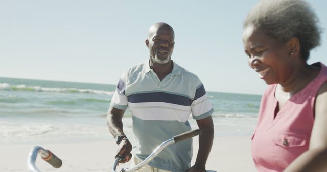 Senior couple enjoying beach bike ride - Download Free Stock Images Pikwizard.com