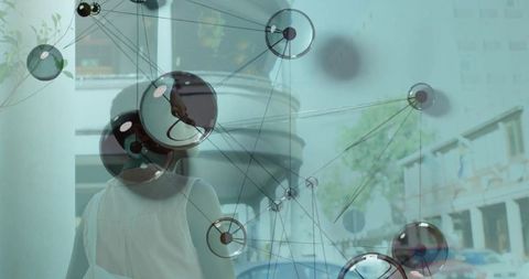 Woman walking in city with digital network overlay