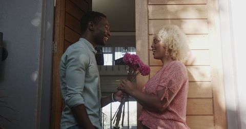 Warm Welcome with Flowers and Joyful Smiles