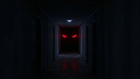 Sinister red eyes in shadowy hallway