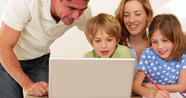 Happy Family Learning Together on Laptop - Download Free Stock Images Pikwizard.com