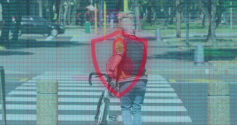 Pushing bike across crosswalk with cybersecurity shield and digital matrix code overlay
