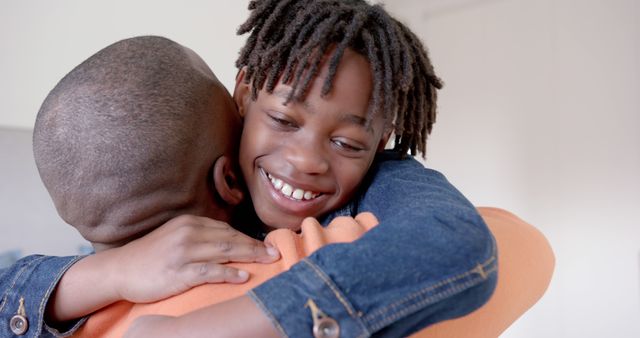 Happy Child Smiling and Hugging Parent Indoors - Download Free Stock Images Pikwizard.com