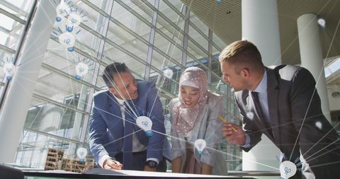 Diverse Businesspeople Collaborating Over Strategic Plans