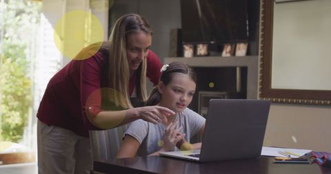 Mother and Daughter Bond Over Learning with Laptop