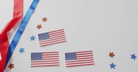 Patriotic Decor with American Flags and Ribbons on White