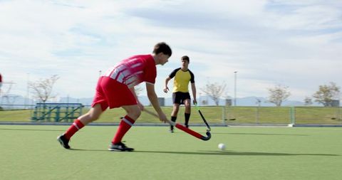 Dynamic Field Hockey Match on Outdoor Turf Pitch