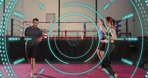 Boxing coach guiding women skipping rope with futuristic teal hud overlay in gym ring