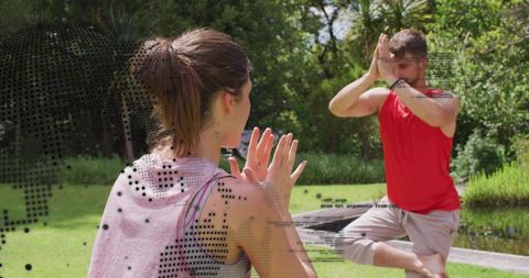 Couple practicing outdoor balance exercises by pond with dotted digital overlay