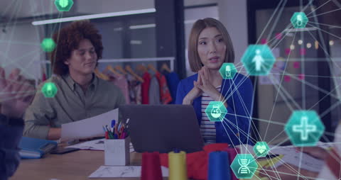 Diverse Team Collaborating with Medical Tech Interfaces