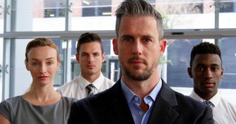 Diverse Group of Business Professionals Confidently Posing in Office