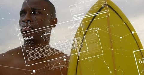 Shirtless surfer scanning augmented reality data while carrying yellow surfboard