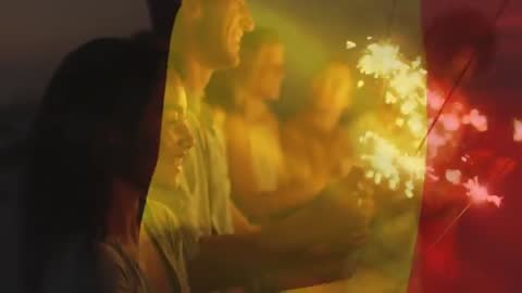 Joyful Beachside Gathering with Sparkler Celebration at Dusk