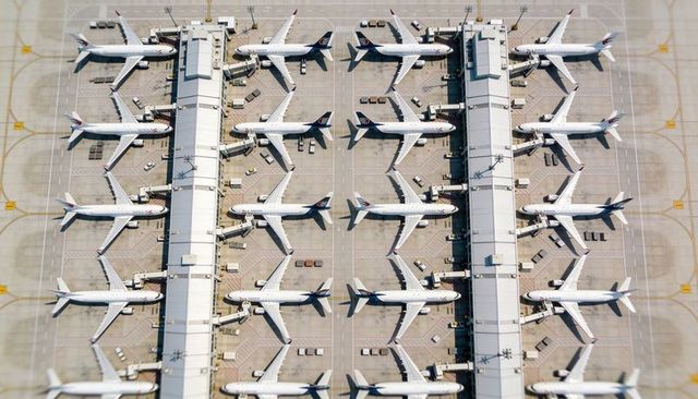 Aerial terminal with parallel piers and narrow-body jets docking at gates