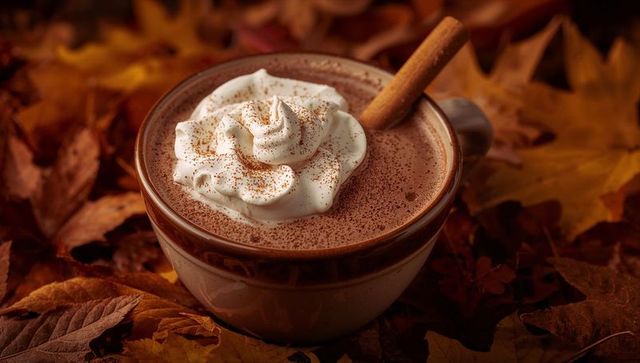 Cozy Hot Chocolate Surrounded by Autumn Leaves
