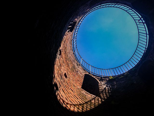 Looking Up from Inside Old Brick Well with Blue Sky - Download Free Stock Photos Pikwizard.com