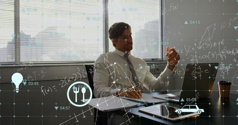 Innovative caucasian man engaging with digital data concepts at work desk
