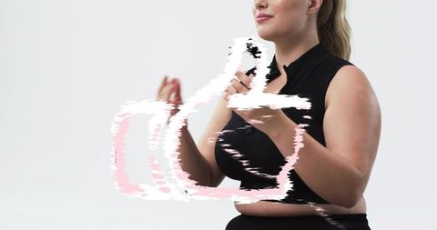 Confident presenter gesturing with hands and pink brushstroke glitch overlay, copy space
