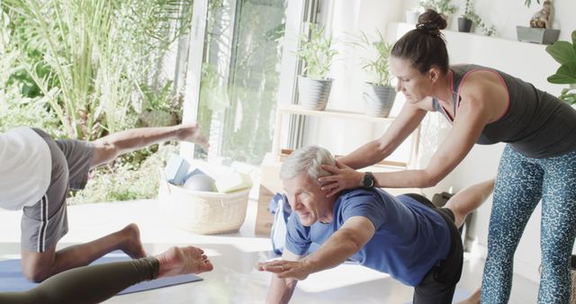 Senior Man Practicing Yoga Under Instructor Guidance in Bright Room - Download Free Stock Images Pikwizard.com