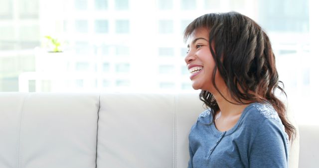 Happy Young Girl Relaxing at Home on White Couch - Download Free Stock Images Pikwizard.com