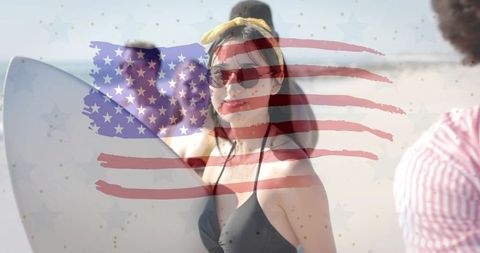 Smiling woman holding surfboard with american flag overlay on sunny beach summer lifestyle