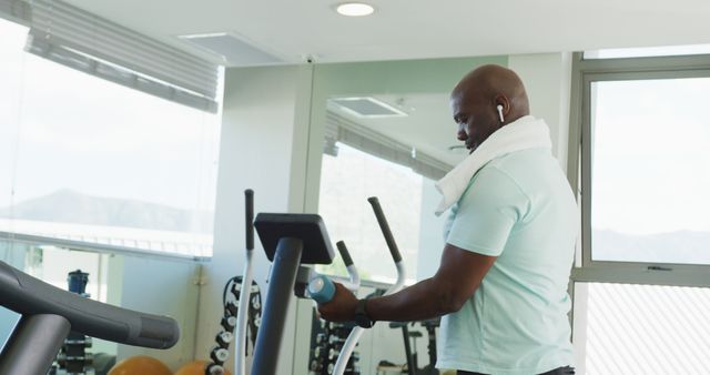 Image of senior african american men is exercising at the gym. Retirement lifestyle, active leisure time.