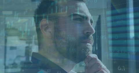 Businessman analyzing data with virtual screen overlay