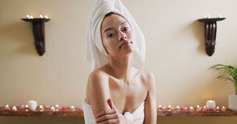 Relaxed Woman in Towel Turban Enjoying Spa at Home