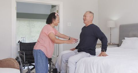 Senior Asian Couple Caring and Supporting Each Other at Home