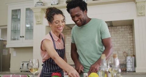 Happy Couple Cooking Joyfully Together in Modern Kitchen