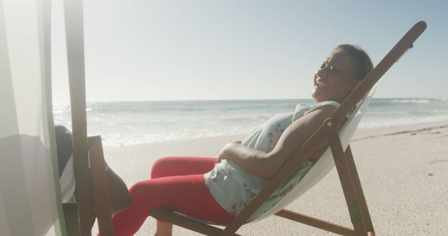 Relaxing Senior Woman Sunbathing on Sunny Beach - Download Free Stock Images Pikwizard.com