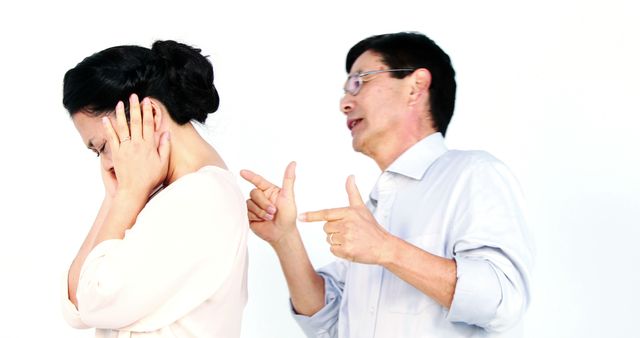 Frustrated Couple in Argument with Man Pointing and Woman Covering Ears - Download Free Stock Images Pikwizard.com