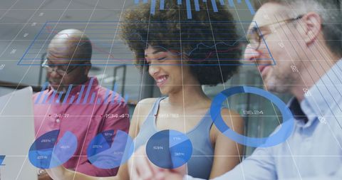 Diverse Team Analyzing Statistics with Digital Interface