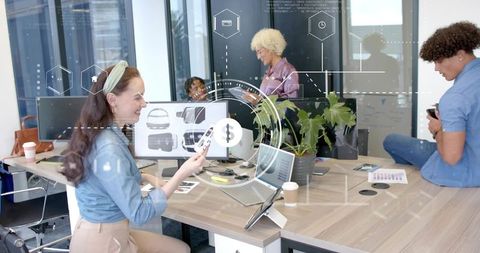 Multicultural team collaborating on product design with augmented reality and mobile tech